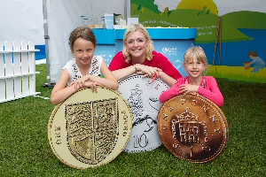 Sisters Mary Anne and Emily Beacock (L to R) from Sheriff Bank in Cumbria got to grips with the value of water at the United Utilities roadshow event at Southport Flower Show.
