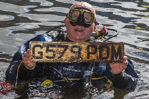 Simon Wood with a car number plate found in the dock