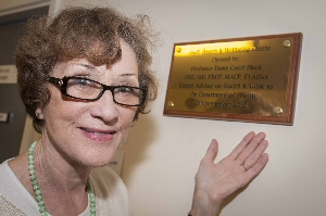 Dame Carol Black inside with a plaque to mark the occasion.