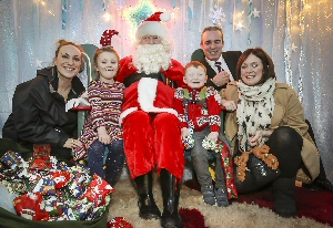 From left to right; Lauren Knights, Marketing and Communications Executive for Claire House, Ava Johnson, Santa Claus, George Johnson, Derek Millar, Commercial Director for Pyramids Shopping Centre and George and Avas mum Emma.