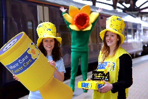  L to R Natalie Atherley from Marie Curies fundraising team and Becky Daniels from Northern Rail celebrate the partnership with Daffy, the Marie Curie mascot