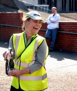 Ninette Thomas opens a well-deserved bottle of bubbly after her 150-mile trek.