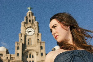 Naomi Daly, an aspiring model, in front of the Liver Buildings.