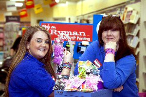 Ryman Sales Assistant Beth Finley and Deputy Manager Jenny Scott with the loom bands at the Pyramids Shopping Centre branch.