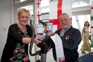 Becky Bethom gets on her bike to Brazil in a 5,438-mile bid to raise funds for the Ride to Ryder challenge, with Jeff Tabern, who donated the exercise cycle.