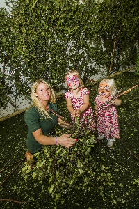 19 Building a hide with the help of Laura Williams, Forest School Leader for the project, are Leah Woods , 4 and her sister Isabella, 2 from West Kirby