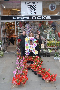 Photo caption: Say it with flowers: Richard Moore and Faye Walker from Fishlocks, with R Charitys Loren Slade