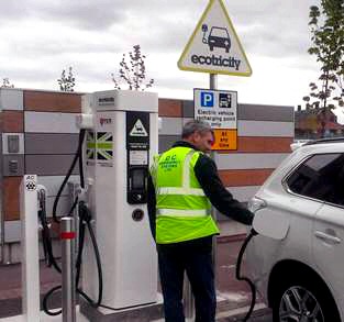 Keith Hollings of DC Emergency Systems Limited who are the Airports LED energy saving lighting contractor recharging his Mitsubishi Outlander plug in hybrid car at LJLA