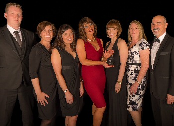 Picture shows members of the Trust cancer services team who won a Team of the Year title at the Trusts annual staff Pride Awards in June. Dr Paul Mansour is pictured right. Please credit image to Baker Lodge Studios.