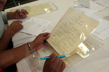 Photo 2 – A participant looks at an archive letter entitled 'A Petition to the Lord Mayor of Liverpool from the African Christian Association.'