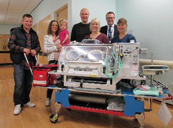 Picture shows, from the left, Milly and Steph Beqo with daughter, Mia; Andrew and Sarah Malm; Simon Featherstone, Director of Nursing and Quality; Sister Karen Wareing, Neonatal Ward Manager