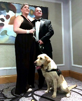 Dog handler Constable Steve Adams with his wife, Joanne, and Champ.