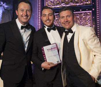 From L-R  Compere at the Liverpool City Region Tourism Awards 2016, Andrew Dickens, pictured with Josh Boyd from Orb CIC and Andrew Dwerryhouse from Wild Thang who sponsored the award.