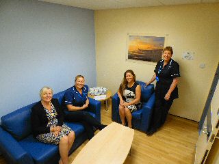 Photo caption: Cheryl and Lisa from Community Link Foundation with hospital staff in the new relatives room.